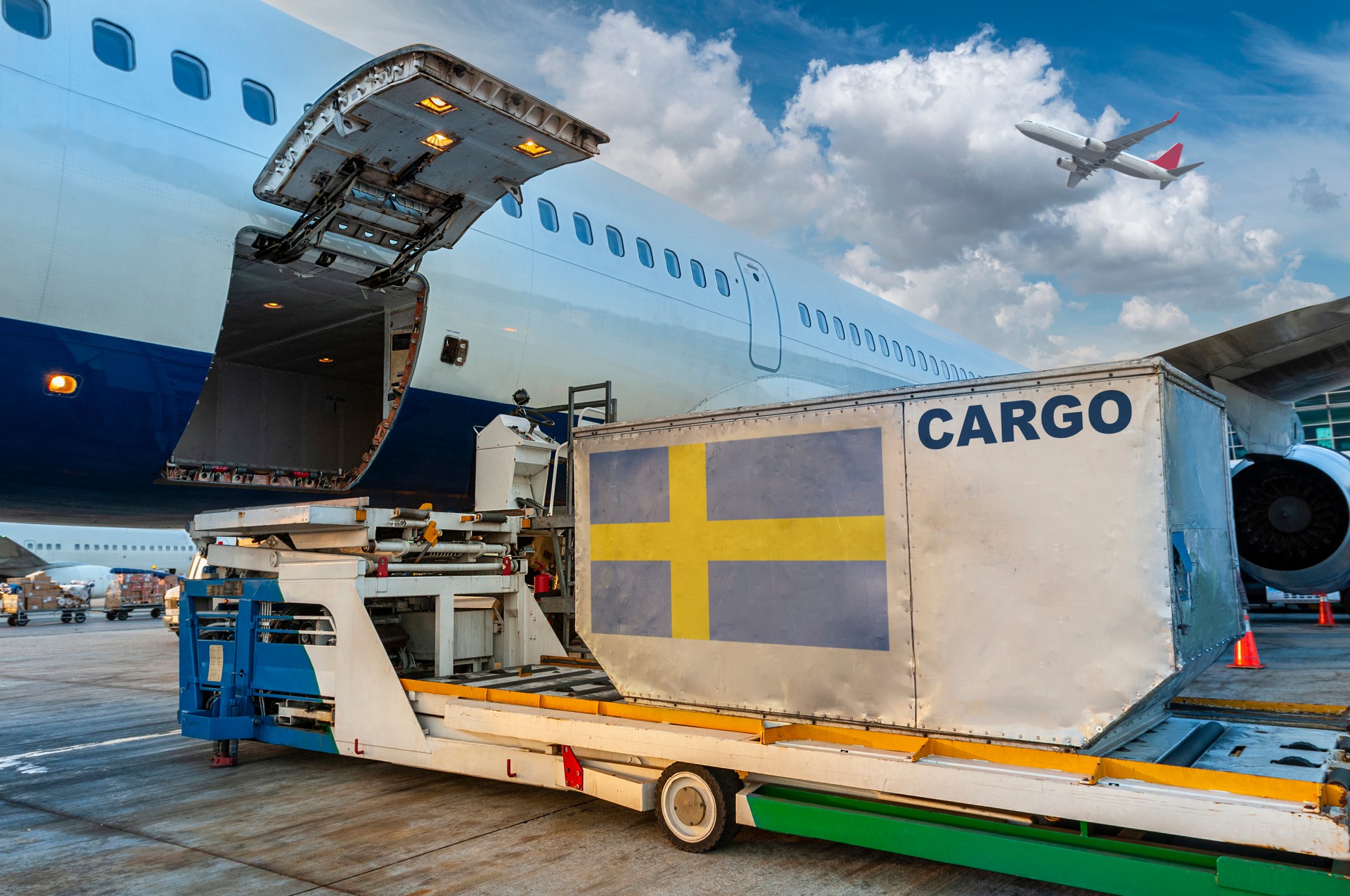 Loading the container in the cargo airplane.